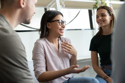 Group of people sitting together during therapy session