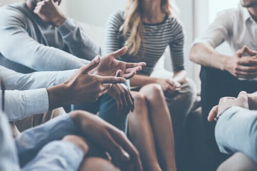 Group of patients sitting in a circle during outpatient treatment