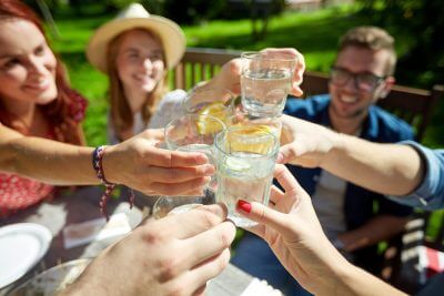 group of people enjoying a sober party in the summer time